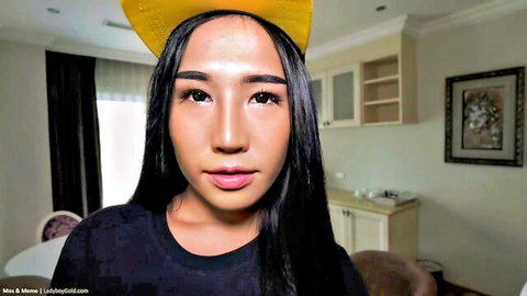 Asian woman Mos smiling in yellow hat, teasing for threesome with Meme