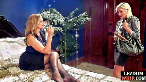 Busty blonde MILF smokes cigarette dominating submissive in lezdom scene
