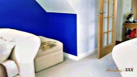 Empty cozy room interior with blue accent wall white sofa and open door