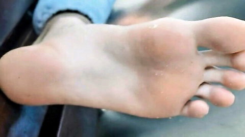 Close-up of sweaty bare male foot sole with dirty toes spread wide for gay foot fetish worship