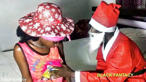 Ebony beauty in pink top and blindfold teases black Santa in holiday fantasy