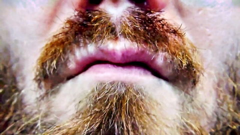 Close-up of bearded man with open mouth, teasing oral action in adult thumbnail