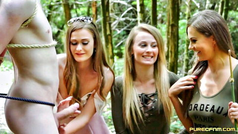 Three clothed women tease bound naked man in steamy CFNM woods scene