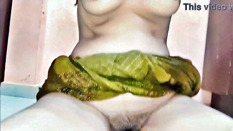 Indian woman spreads legs wide exposing hairy pussy and bare tits in green saree
