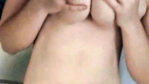 MILF squeezes her massive saggy natural tits together exposing erect nipples