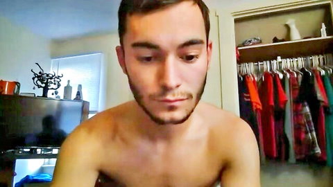 Shirtless handsome young man with beard in amateur gay setup, rough sex vibe