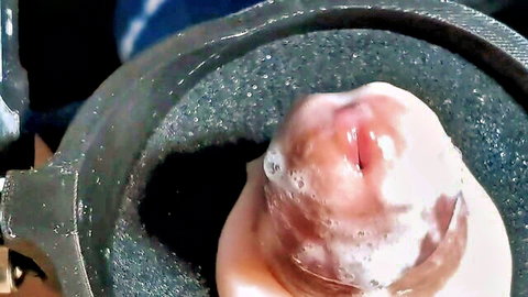 Close-up of throbbing cock ejaculating massive load into machine grinder