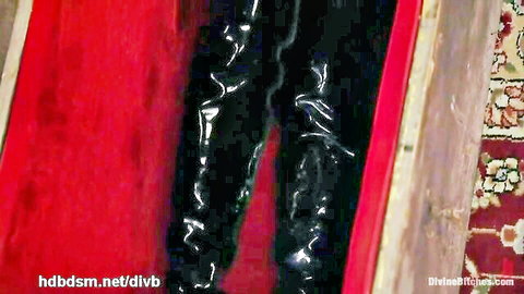 Curvy woman's big round ass in tight shiny black latex pants closeup tease