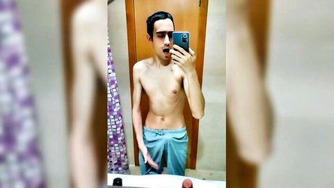 Skinny amateur white twink takes bathroom mirror selfie pulling down blue underwear teasing cock