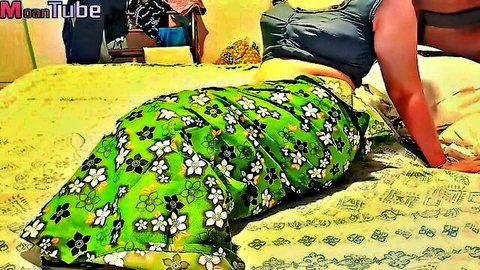 Vilashini in seductive side pose wearing green floral skirt and black top