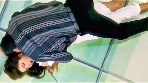 Sexy South Asian babe passionately kissing hunk with legs spread on wet glass floor
