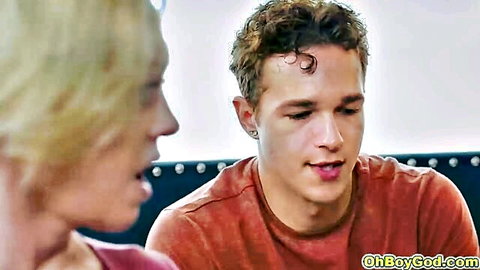 Williams in pink top chats intimately with curly-haired stepson