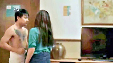 Shirtless tattooed Asian man with Filipina woman in green top and jeans, VivaMax adult scene