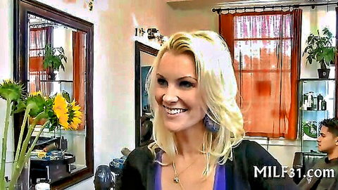 Voluptuous blonde MILF smiling with deep cleavage