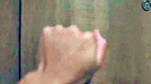 Close-up of woman's hand against wooden door in Rapsa babe 3 scene