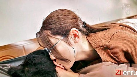 Stepmom in glasses kissing stepson passionately on bed