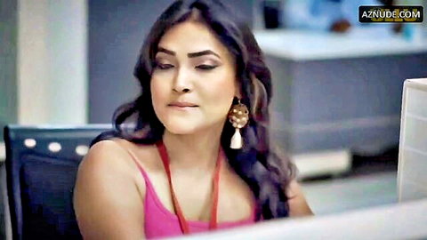 Mature Indian woman in tight pink tank top with deep cleavage looking seductive