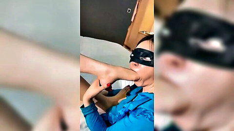 Blindfolded Chinese woman sucks toes in lesbian femdom foot worship
