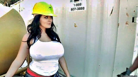 Busty brunette construction babe in yellow hardhat with huge tits spilling from tight white tank top