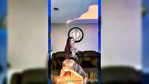 Purple-haired tattooed woman in lingerie bending over big ass tease