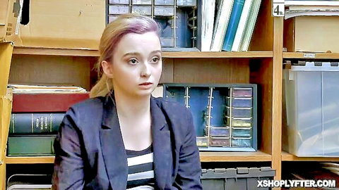Lexi Lore in Shoplyfter interrogation, blonde with pink hair in blazer