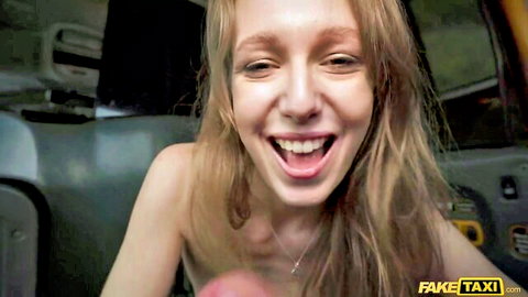 Blonde babe in Fake Taxi laughing wide while squeezing her perky bare tits topless