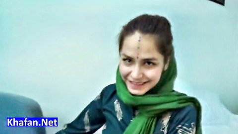 Smiling Persian brunette babe in green hijab and dupatta teasing seductively