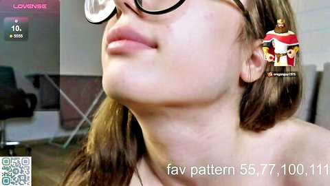 Anna Countach close-up in glasses, blonde hair, teasing expression