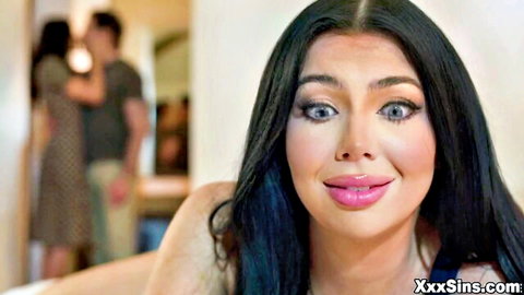 Seductive brunette with glossy plump lips and smoky eyes smirks teasingly at camera