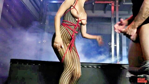Maya Bijou bound in red ropes harness, sensual domination by man, hardcore BDSM passion