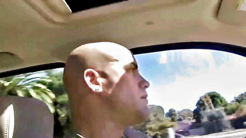 Bald tattooed guy in car, scenic drive after picking up blond bunny