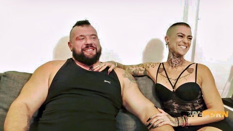 Buff Spanish strongman and hot goth wife in lingerie smiling