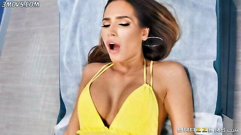 Desiree Dulce in yellow dress, mouth open in pleasure, Brazzers scene