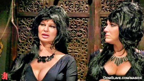 Busty dominatrix MILFs in black dresses, lesbian BDSM whipping scene
