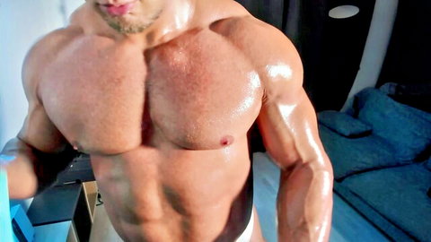 Bishop Angus flexing massive ebony muscles in white briefs