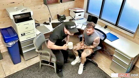 Muscular authority figure confronts tattooed young man in gay roleplay