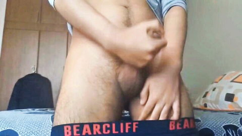 Hairy bear guy grabs his bulging cock and balls in tight Bearcliff underwear