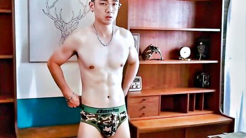 Chinese twink posing shirtless in camouflage underwear