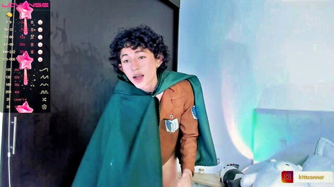 Cute curly-haired twink in Attack on Titan cosplay teases with open mouth on webcam