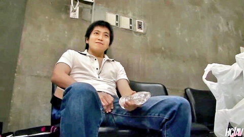 Asian man in white shirt and jeans sits smiling in HC JAV video thumbnail