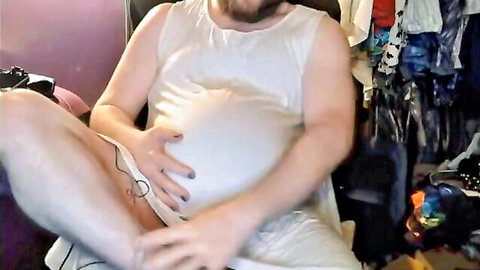 Bearded pregnant man in white maternity sundress holding swollen belly