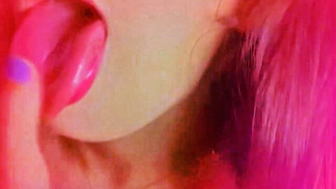 Close-up of seductive woman with pink glossy lips and tongue out, teasing throat fetish