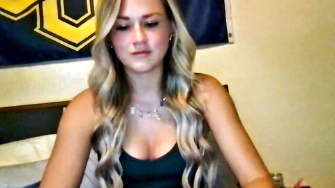 Stella Rose20 blonde camgirl showing cleavage in black top