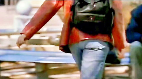 Elizabeth Cromwell in red jacket and jeans, walking away in The Strangler's Wife (2002)