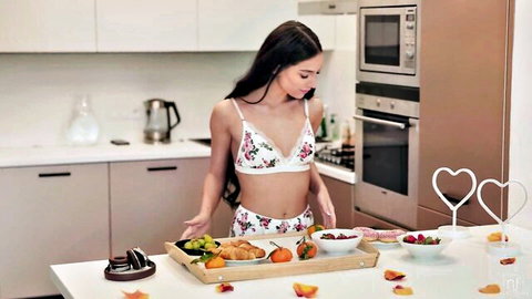 Stunning brunette in white floral lingerie with sensual breakfast tray