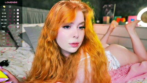 Redhead webcam girl lies ass up on bed teasing pussy in white thong