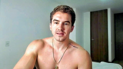 Sexy shirtless muscular hunk with Malice chest tattoo and gold chain necklace on webcam