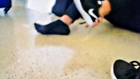 Graham H American student feet in black socks and Nike sneakers