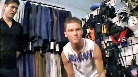Two horny athletic boys in store, muscular guy in tank top smirks