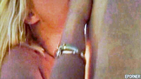 Blonde lesbian passionately kissing her partner's neck in hot intimate embrace